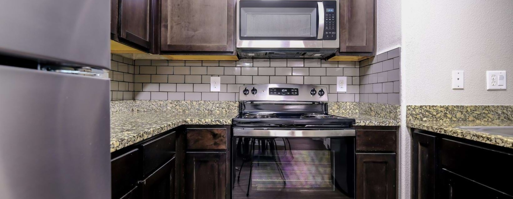 a kitchen with black appliances