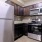 a kitchen with black appliances