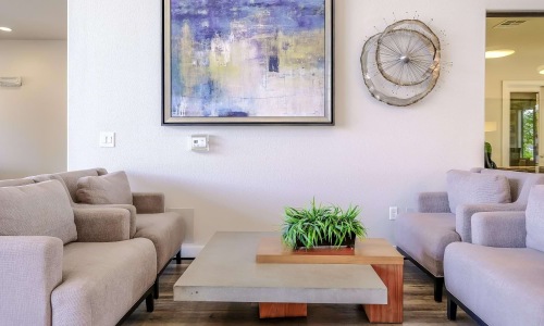 a living room with a large painting